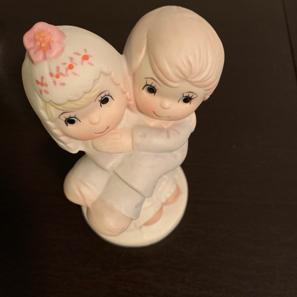 Bride Holding Groom Cake Top Figurine